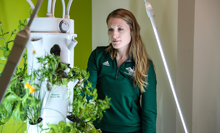 At 58 inches high, the Tower Garden doesn’t “tower” over the Slippery Rock University students who use the indoor plant growing system. However, as a tool for both classroom learning and professional development, the Tower Garden is helping SRU students reach new heights when it comes to wellness education.