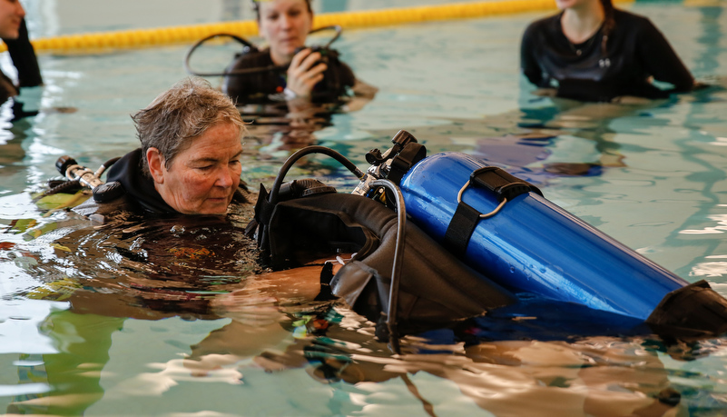 Students learning about scuba diving with accessability issues