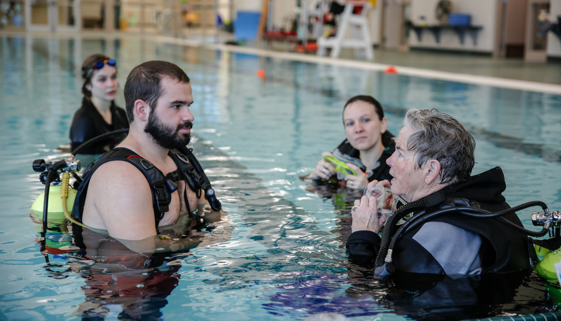 Students learning about scuba diving with a disability