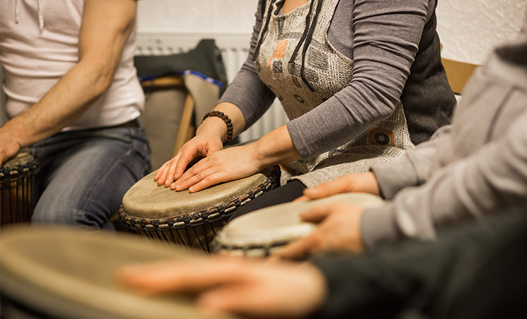 Music Therapists playing drums