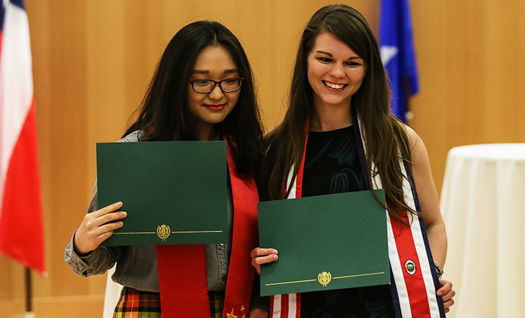 Students stop for a photograph after the 2018 Global Graduation
